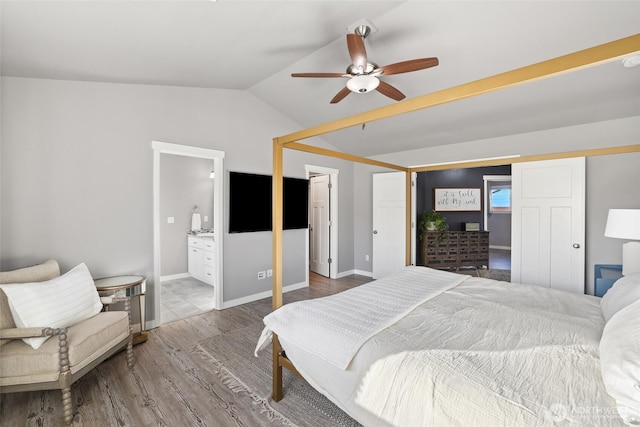 10713 Palisades St SE, Yelm, WA 98597 - bedroom featuring wood finished floors, vaulted ceiling, ensuite bathroom, and a ceiling fan