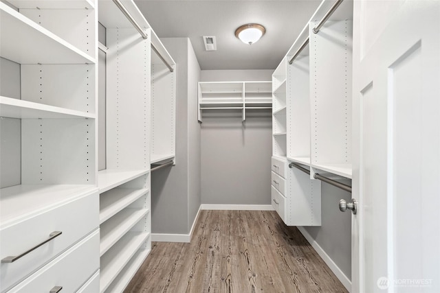 10713 Palisades St SE, Yelm, WA 98597 - spacious closet with wood finished floors