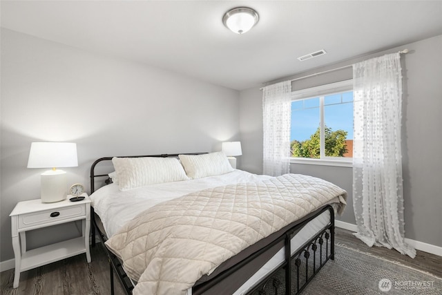 10713 Palisades St SE, Yelm, WA 98597 - bedroom featuring baseboards and dark wood-style floors
