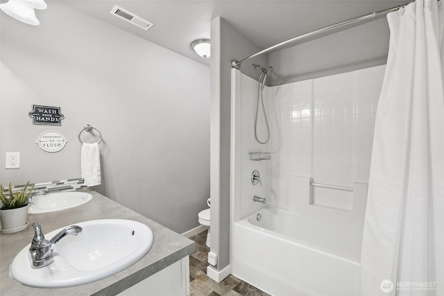 10713 Palisades St SE, Yelm, WA 98597 - full bathroom with shower / bath combo with shower curtain, toilet, double vanity, and baseboards