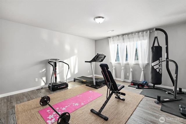 10713 Palisades St SE, Yelm, WA 98597 - workout room featuring wood finished floors and baseboards