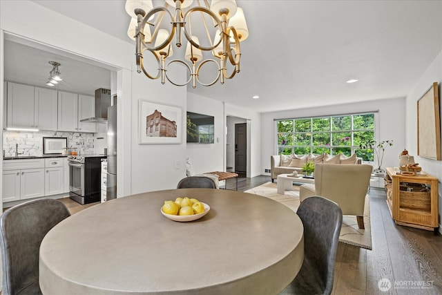 1420 Bellevue Way SE Unit 14, Bellevue, WA 98004 - dining area featuring wood finished floors, a chandelier, and recessed lighting