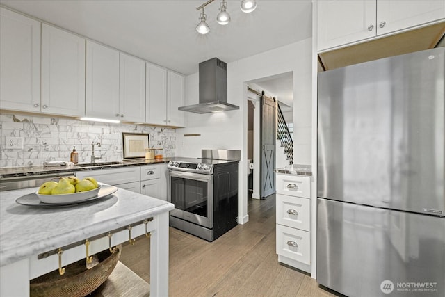 1420 Bellevue Way SE Unit 14, Bellevue, WA 98004 - kitchen featuring stainless steel appliances, wall chimney range hood, a sink, a barn door, and white cabinetry