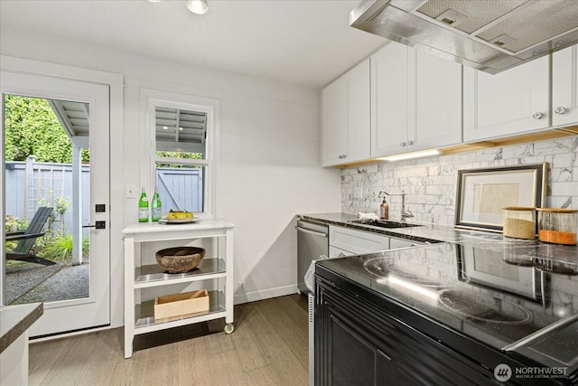 1420 Bellevue Way SE Unit 14, Bellevue, WA 98004 - kitchen featuring a sink, light wood-type flooring, wall chimney range hood, white cabinetry, and tasteful backsplash