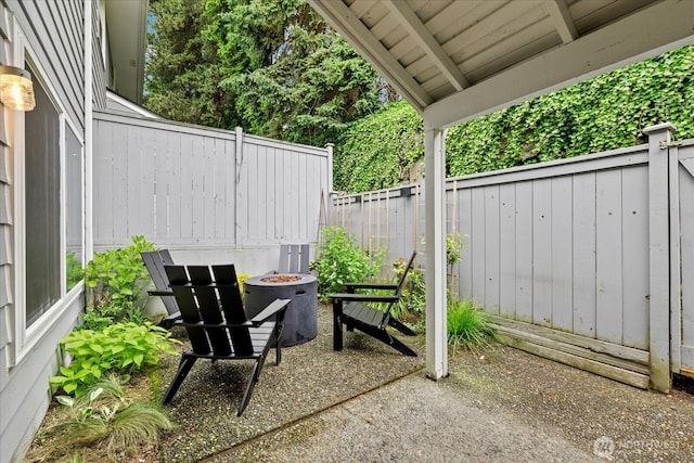 1420 Bellevue Way SE Unit 14, Bellevue, WA 98004 - view of patio featuring a fire pit