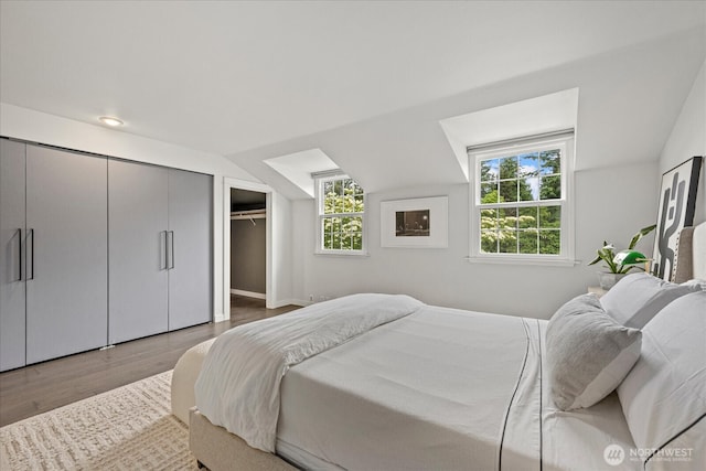 1420 Bellevue Way SE Unit 14, Bellevue, WA 98004 - bedroom with wood finished floors and baseboards