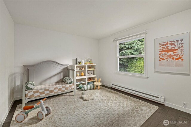 1420 Bellevue Way SE Unit 14, Bellevue, WA 98004 - bedroom featuring a baseboard radiator, wood finished floors, and baseboards