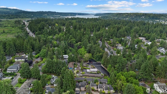 1420 Bellevue Way SE Unit 14, Bellevue, WA 98004 - aerial view of property and surrounding area with a heavily wooded area, a mountainous background, and nearby suburban area