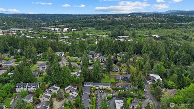 1420 Bellevue Way SE Unit 14, Bellevue, WA 98004 - aerial view of property's location with a heavily wooded area, a mountain backdrop, and nearby suburban area