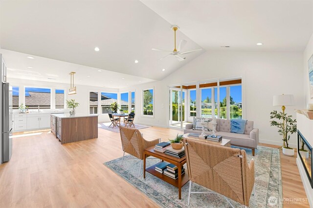 5425 Salish Rd, Blaine, WA 98230 - living room with ceiling fan, light wood-style floors, recessed lighting, and high vaulted ceiling