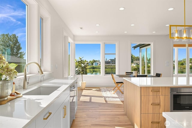 5425 Salish Rd, Blaine, WA 98230 - kitchen with a sink, light wood-style floors, plenty of natural light, recessed lighting, and stainless steel appliances