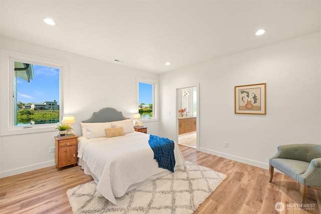 5425 Salish Rd, Blaine, WA 98230 - bedroom with light wood-style floors, baseboards, recessed lighting, and ensuite bath