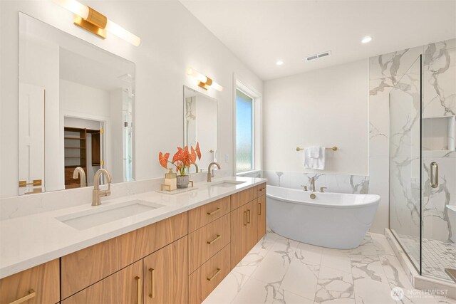 5425 Salish Rd, Blaine, WA 98230 - bathroom featuring a soaking tub, recessed lighting, double vanity, a marble finish shower, and marble finish flooring
