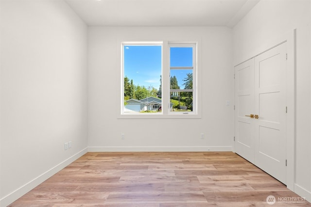 5425 Salish Rd, Blaine, WA 98230 - unfurnished bedroom with light wood-style floors and baseboards