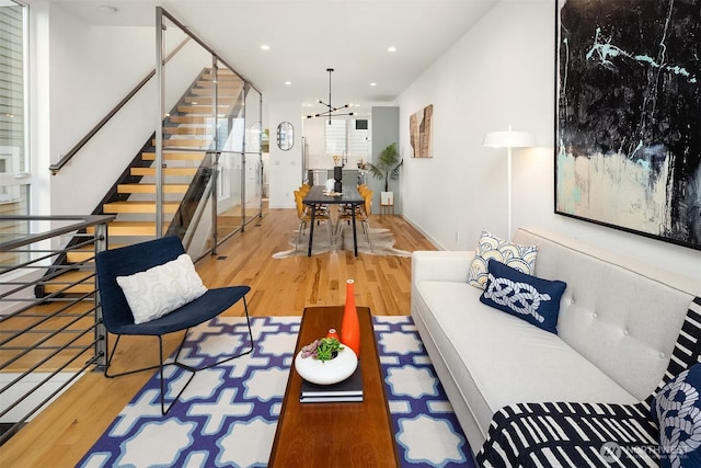 3852 Beach Dr SW Unit A, Seattle, WA 98116 - living room featuring wood finished floors, stairway, recessed lighting, and a chandelier