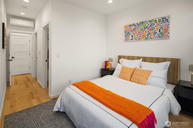 3852 Beach Dr SW Unit A, Seattle, WA 98116 - bedroom featuring an AC wall unit, recessed lighting, and wood finished floors