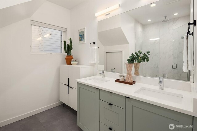 3852 Beach Dr SW Unit A, Seattle, WA 98116 - bathroom with a marble finish shower, double vanity, tile patterned floors, and recessed lighting