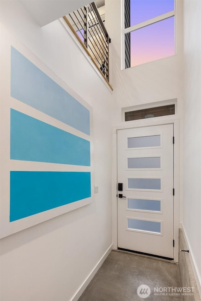 3852 Beach Dr SW Unit A, Seattle, WA 98116 - doorway to outside with concrete flooring and a high ceiling
