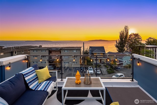 3852 Beach Dr SW Unit A, Seattle, WA 98116 - balcony at dusk with outdoor lounge area