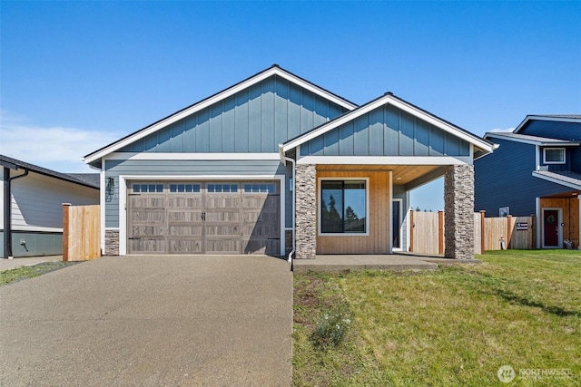 2114 Hawks View Ln, Winlock, WA 98596 - view of front of property with stone siding, an attached garage, asphalt driveway, and board and batten siding