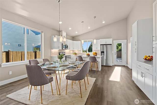 2114 Hawks View Ln, Winlock, WA 98596 - dining area featuring baseboards, dark wood-style flooring, recessed lighting, and high vaulted ceiling