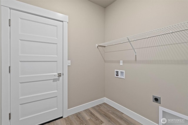 2114 Hawks View Ln, Winlock, WA 98596 - washroom with hookup for an electric dryer, baseboards, washer hookup, and wood finished floors