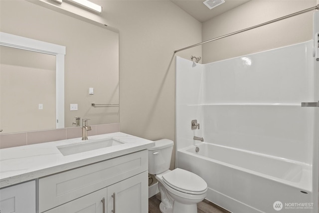 2120 Hawks View Ln, Winlock, WA 98596 - bathroom with toilet, vanity, shower / bathtub combination, and wood finished floors