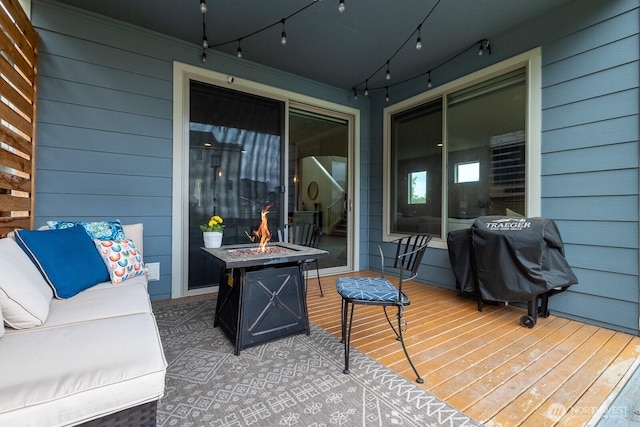 8223 31st Street Ct E, Edgewood, WA 98371 - deck with an outdoor fire pit and area for grilling