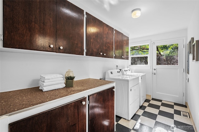 2342 N 120th St, Seattle, WA 98133 - laundry area with light floors, cabinet space, and washer and dryer