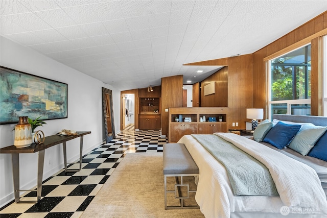 2342 N 120th St, Seattle, WA 98133 - bedroom featuring tile patterned floors, wooden walls, and baseboards