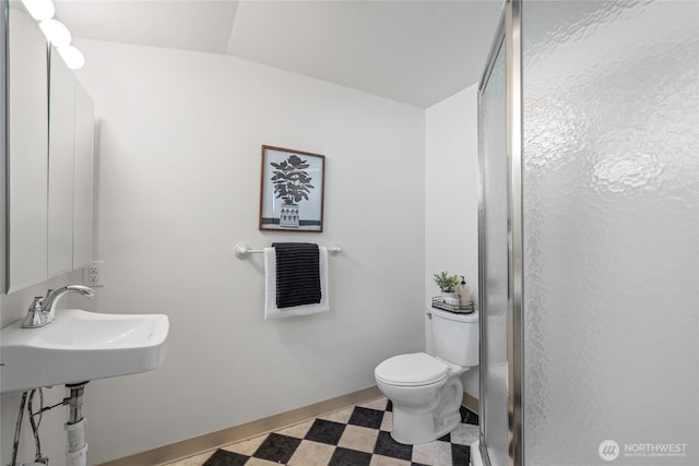 2342 N 120th St, Seattle, WA 98133 - bathroom with toilet, a shower stall, tile patterned floors, and baseboards