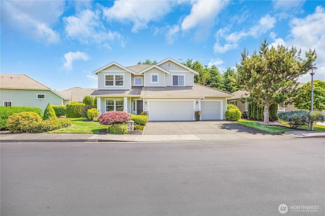 7118 Ashdown Ln SE, Olympia, WA 98513 - view of front of home featuring driveway, board and batten siding, a garage, and an attached garage