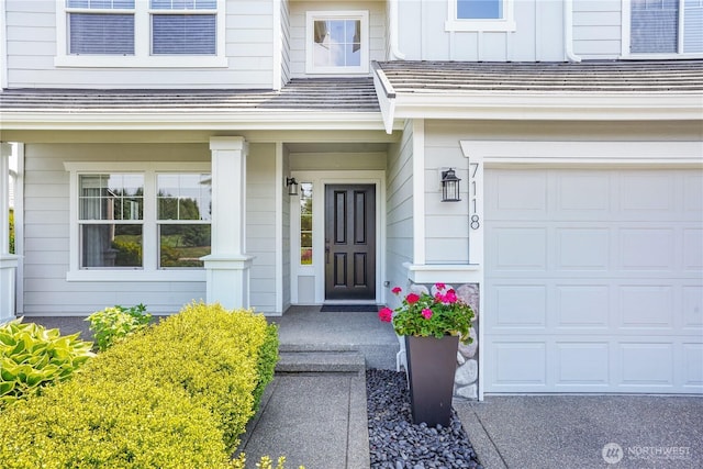 7118 Ashdown Ln SE, Olympia, WA 98513 - view of exterior entry featuring a garage and covered porch