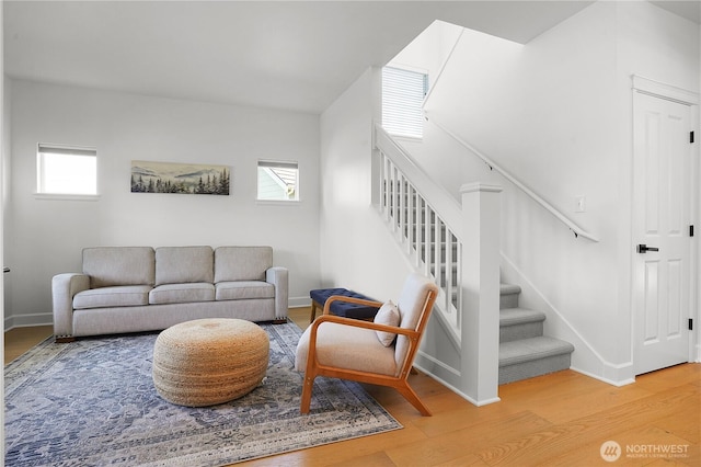 7118 Ashdown Ln SE, Olympia, WA 98513 - living room with wood finished floors, stairway, and baseboards