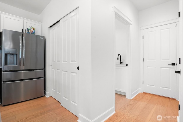 7118 Ashdown Ln SE, Olympia, WA 98513 - hall with light wood-style flooring and baseboards