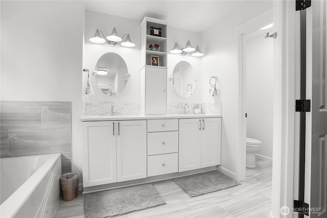 7118 Ashdown Ln SE, Olympia, WA 98513 - bathroom featuring double vanity, toilet, and a bath