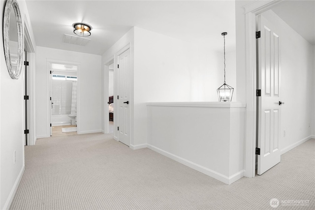 7118 Ashdown Ln SE, Olympia, WA 98513 - hall featuring baseboards, carpet floors, and an upstairs landing