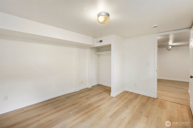 1704 27th Ave, Seattle, WA 98122 - unfurnished bedroom featuring light wood-style floors, baseboards, and a closet