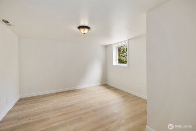 1704 27th Ave, Seattle, WA 98122 - empty room with light wood-style floors and baseboards