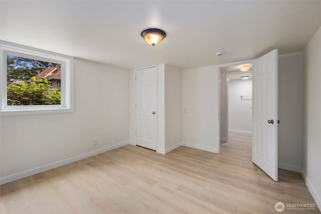 1704 27th Ave, Seattle, WA 98122 - unfurnished bedroom with light wood-style floors and baseboards