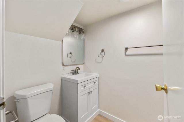 1704 27th Ave, Seattle, WA 98122 - bathroom featuring toilet, vanity, and baseboards