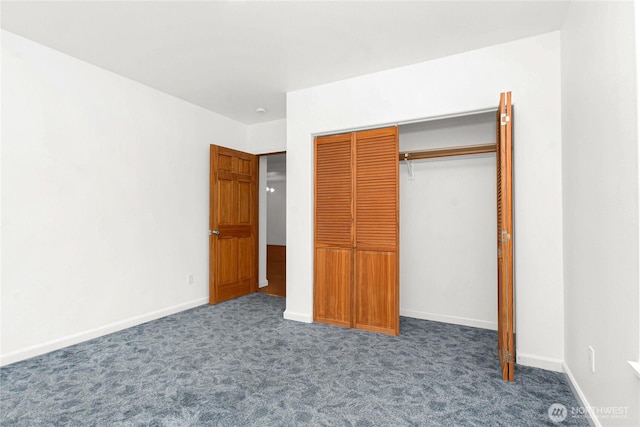 514 Mckinley Ave, Raymond, WA 98577 - unfurnished bedroom with carpet, a closet, and baseboards