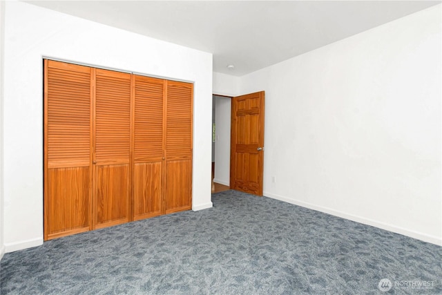 514 Mckinley Ave, Raymond, WA 98577 - unfurnished bedroom with carpet flooring, baseboards, and a closet