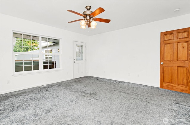 514 Mckinley Ave, Raymond, WA 98577 - spare room featuring carpet floors, a ceiling fan, and baseboards
