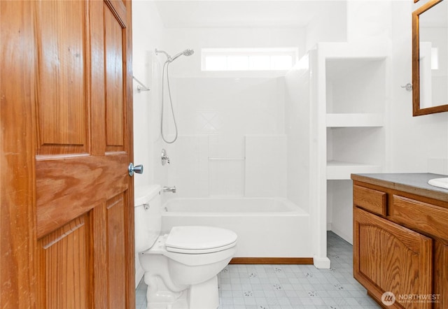 514 Mckinley Ave, Raymond, WA 98577 - bathroom with vanity, toilet,  shower combination, and tile patterned floors