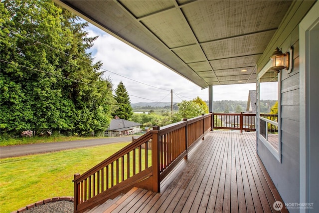 514 Mckinley Ave, Raymond, WA 98577 - wooden deck featuring a lawn