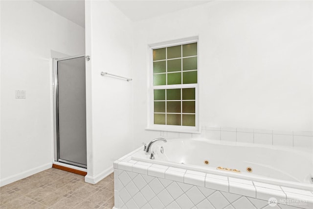 514 Mckinley Ave, Raymond, WA 98577 - bathroom with a stall shower, a jetted tub, and baseboards