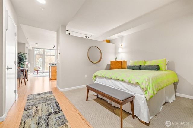 17 W Mercer St Unit 206, Seattle, WA 98119 - bedroom featuring baseboards and light wood finished floors