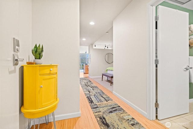 17 W Mercer St Unit 206, Seattle, WA 98119 - hall with baseboards, light wood-style floors, and recessed lighting