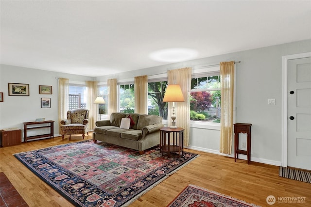 2708 Lynn St, Bellingham, WA 98225 - living area featuring plenty of natural light, wood finished floors, and baseboards